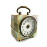 A mother of pearl travel clock