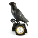 Bronze timepiece, bird of prey on branch