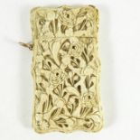 λ A Chinese carved ivory card case