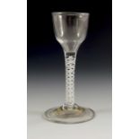 An 18th century opaque twist wine glass, circa 1760,