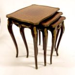 A nest of three Louis XV style parquetry occasional tables