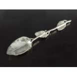 A George II cast silver teaspoon, circa 1750, realistically modelled as a leafy branch, etched and e