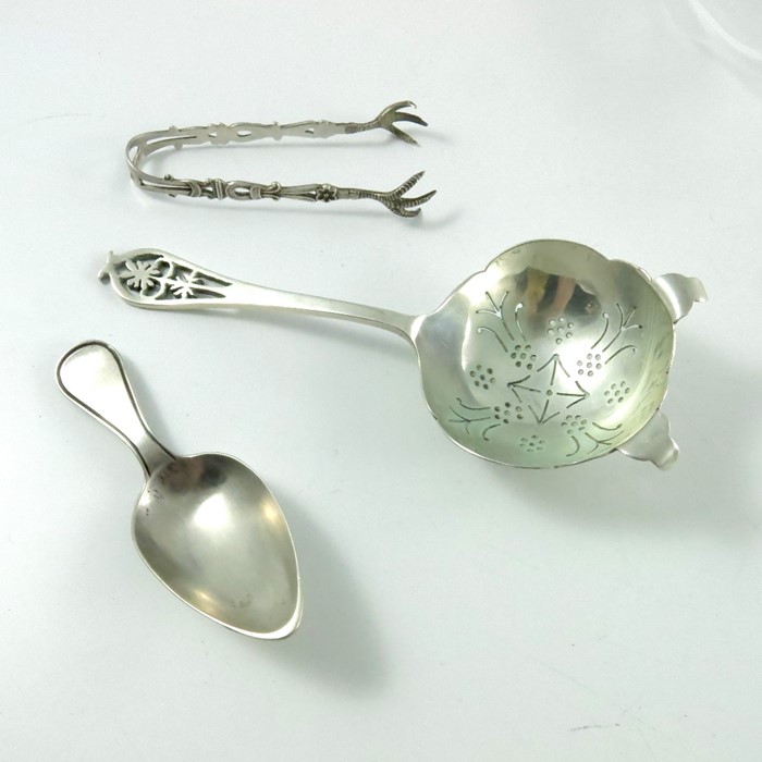 An Elizabeth II silver tea strainer, Edward Viner, caddy spoon and sugar tongs - Image 2 of 2