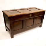 A 17th or 18th century three panelled oak chest