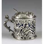 William Comyns, London 1892, a Victorian silver mustard pot, reticulated and embossed in relief with
