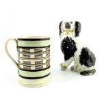 An 18th century Staffordshire creamware tankard and an early pearlware dog