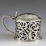Charles Lias, London 1843, a Victorian silver mustard pot, cylindrical form, reticulated with foliat