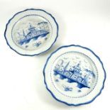 A pair of blue and white pearlware chargers