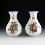 A pair of Baccarat enamelled opaque glass vases