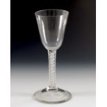An 18th century opaque twist wine glass, circa 1760,