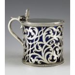 William K. Reid, London 1852, a Victorian silver mustard pot, the drum-shaped body pierced with scro