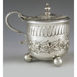William Comyns, London 1881, a Victorian silver mustard pot, rounded beaker form, embossed and repou