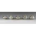 Five English silver mustard pots, Victorian with date marks from 1895 to 1900, various makers, Chest