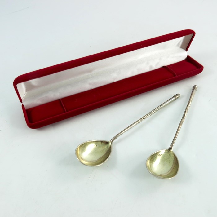 A pair of Imperial Russian spoons, circa 1912, the bowls engraved with a flower and Cyrillic, cased,