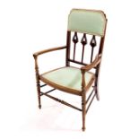 An Arts and Crafts mahogany, beech and satinwood strung armchair