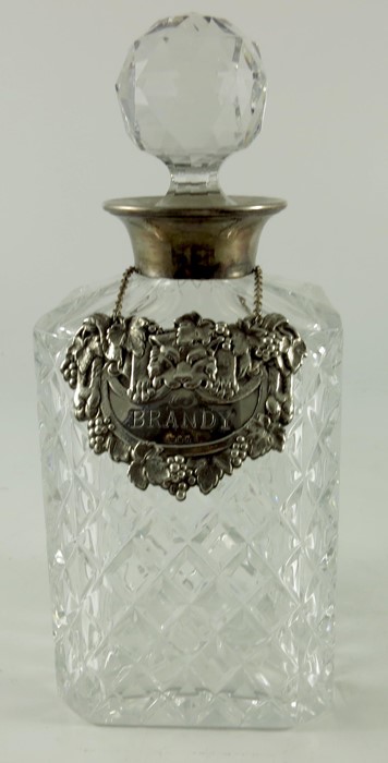 An Elizabeth II silver mounted cut glass spirit decanter, with Brandy label