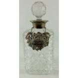 An Elizabeth II silver mounted cut glass spirit decanter, with Brandy label