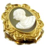 A yellow metal mounted cameo portrait plaque of a figure in Roman toga