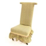 A Victorian pitch pine and upholstered prie dieu chair