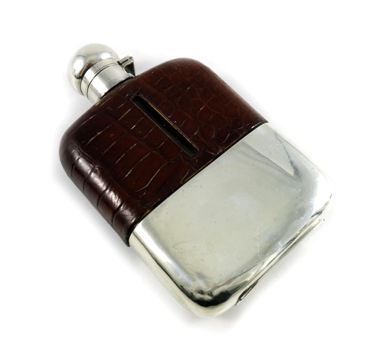 A George V silver, crocodile leather and glass hip flask