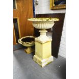 A pair of Victorian cast iron pedestal urn planters