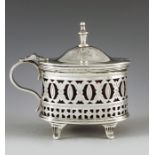 Mappin and Webb, Sheffield 1887, a Victorian silver mustard pot, straight sided oval form, reticulat