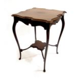 An Arts and Crafts occasional table, in the style of J S Henry