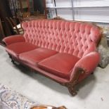 A Victorian style upholstered and carved wood three piece suite