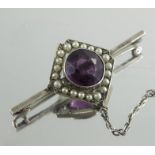 An amethyst and seed pearl brooch