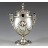 Edward Ker Reid, London 1863, a Victorian silver mustard pot, pedestal urn form, embossed with rams