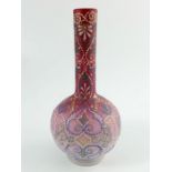 A Victorian enamelled cased glass bottle vase