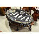 An oval 'Japanned' coffee table