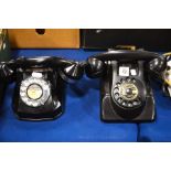 A Monophon black cased telephone and a Taxi Centra
