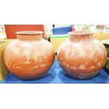 Two large middle eastern pots with foliate decorat
