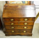 .An antique oak bureau