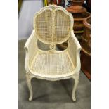 A white painted French armchair