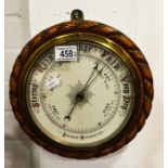 Oak cased aneroid barometer and another