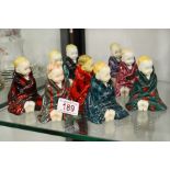 A group of Royal Doulton This Little Pig figures,