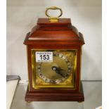 A brass and wooden mantle clock, Elliott, London,