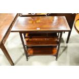 An Edwardian swivel top foldover card table on shelved trolley base, width 80cm