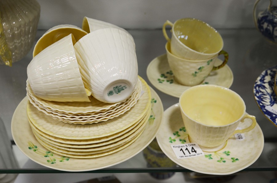 A Belleek pat tea set comprising 7 cups, 8 saucers