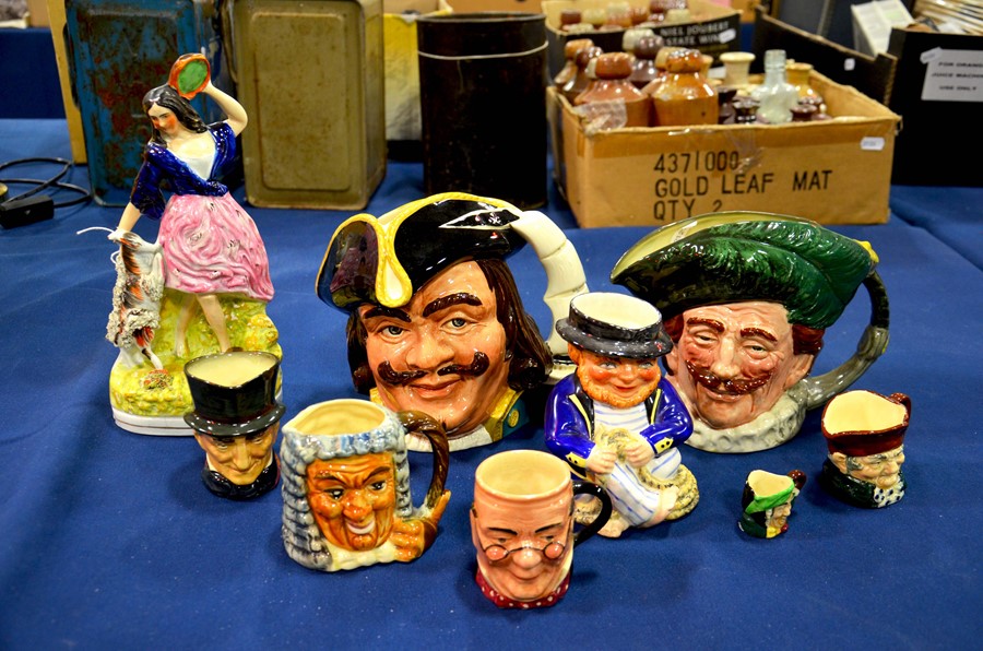 A group of Staffordshire and Royal Doulton charact