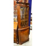 Reproduction corner cabinet, fitted glazed door above cupboard door