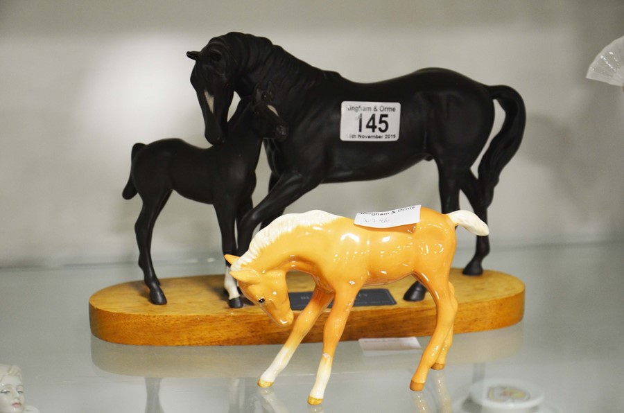 Two Beswick horse figures, one is named Black Beau