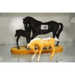 Two Beswick horse figures, one is named Black Beau