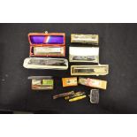 Assorted cased harmonicas, three penknives and miscellaneous objects (11)