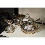 A silver plated tea set, tea pot, sugar bowl and m