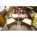 Four upholstered chairs pierced splats