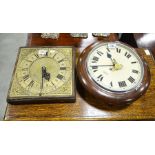 A mahogany cased school clock with white enamelled dial, 34cm overall diameter, and a brass clock