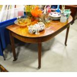 A D'end section of a mahogany dining table